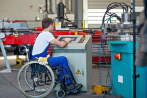Man working in wheelchair while on workers compensation