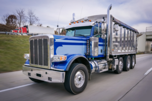 Blue dump truck on the road