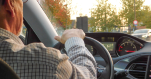 Old man driving car