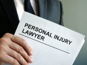 personal injury lawyer holding legal documents