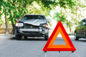 Broken gray car in a hit and run road traffic accident